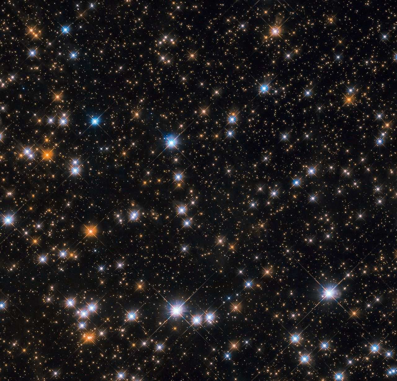 Orange, blue, white, red, and yellow stars dot a black background.