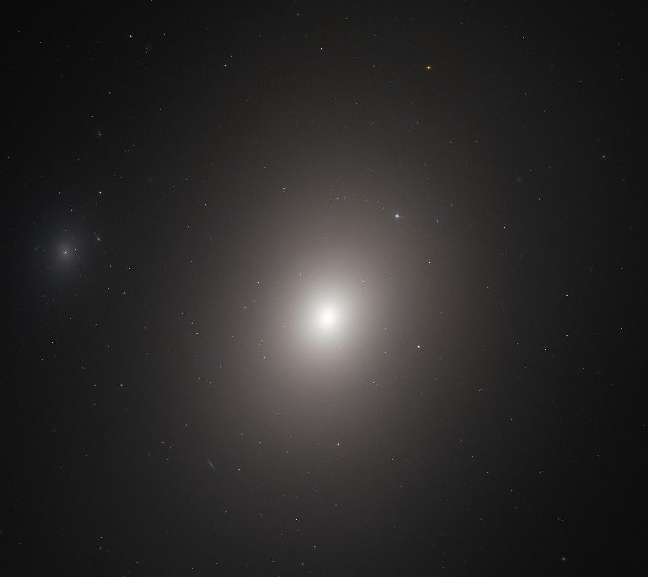 A fuzzy, bright-white oval of light that dims the farther you move away from its bright center.